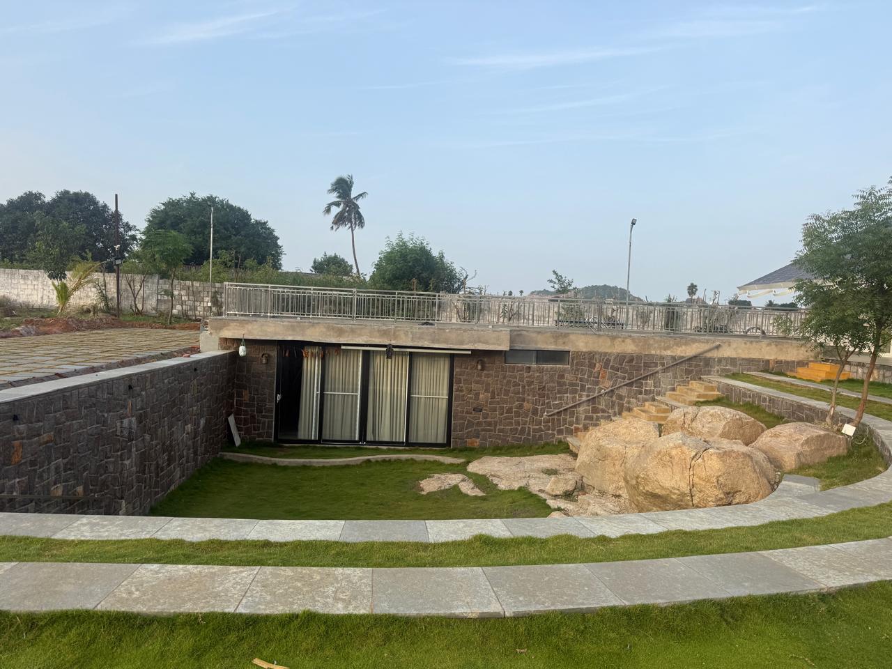 Underground stone courtyard with boulders by day