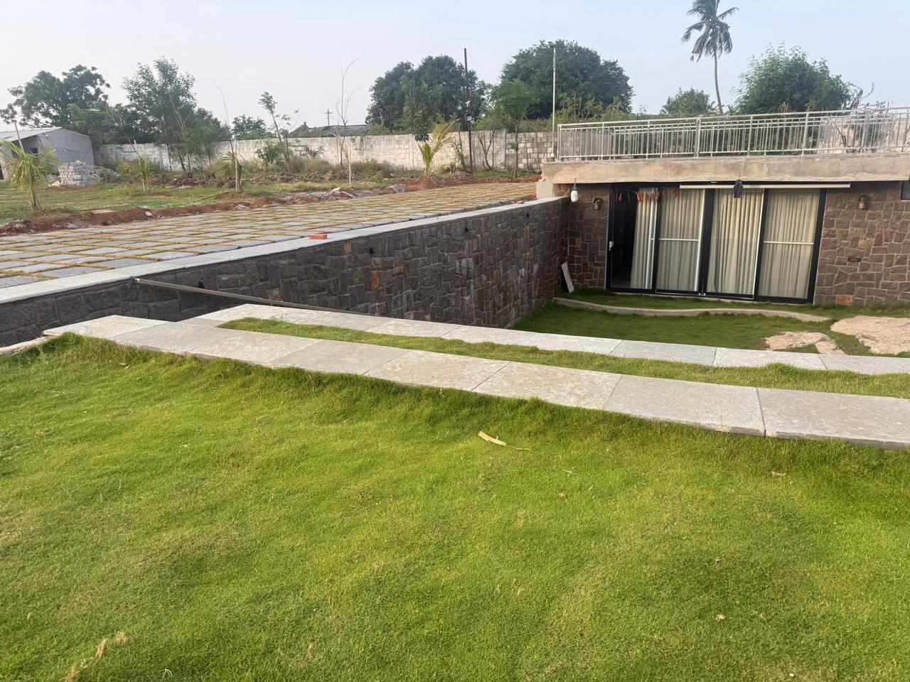 Farmhouse roofline and walkway to the stone courtyard below
