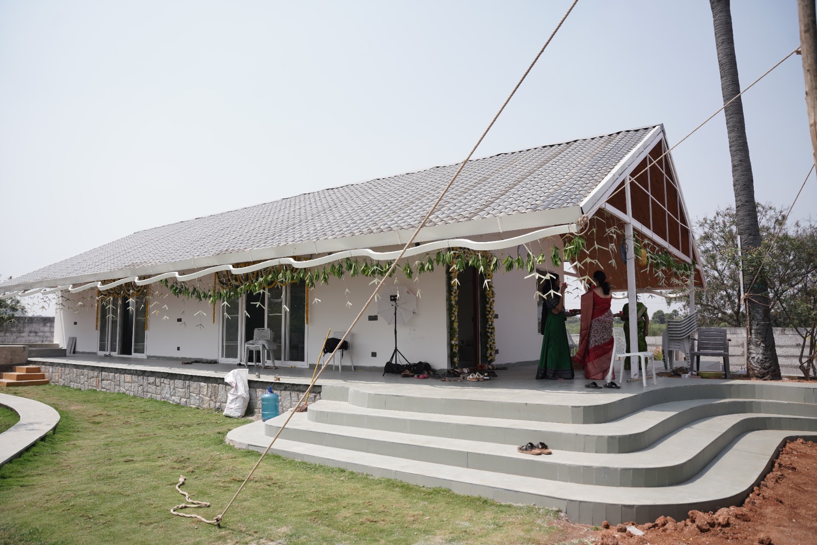 Main house with gabled porch and lawn