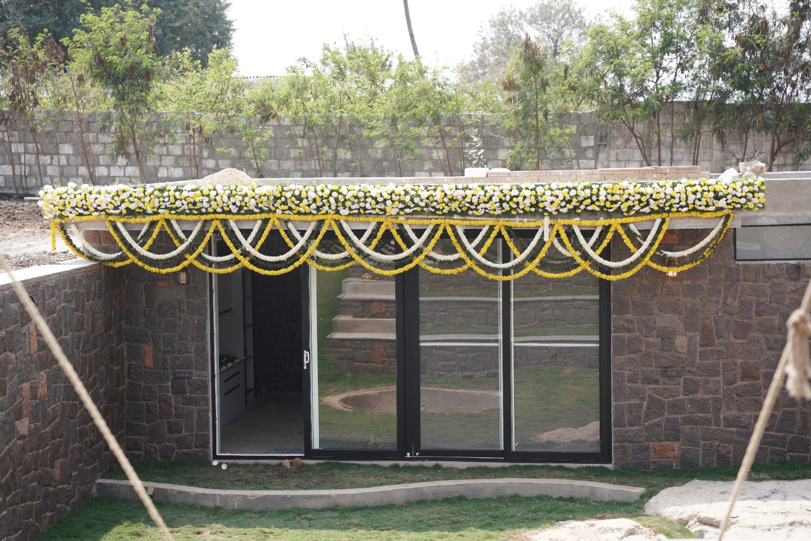 Courtyard entrance framed by garlands